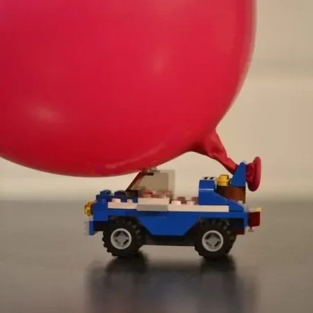 LEGO car powered by large red balloon